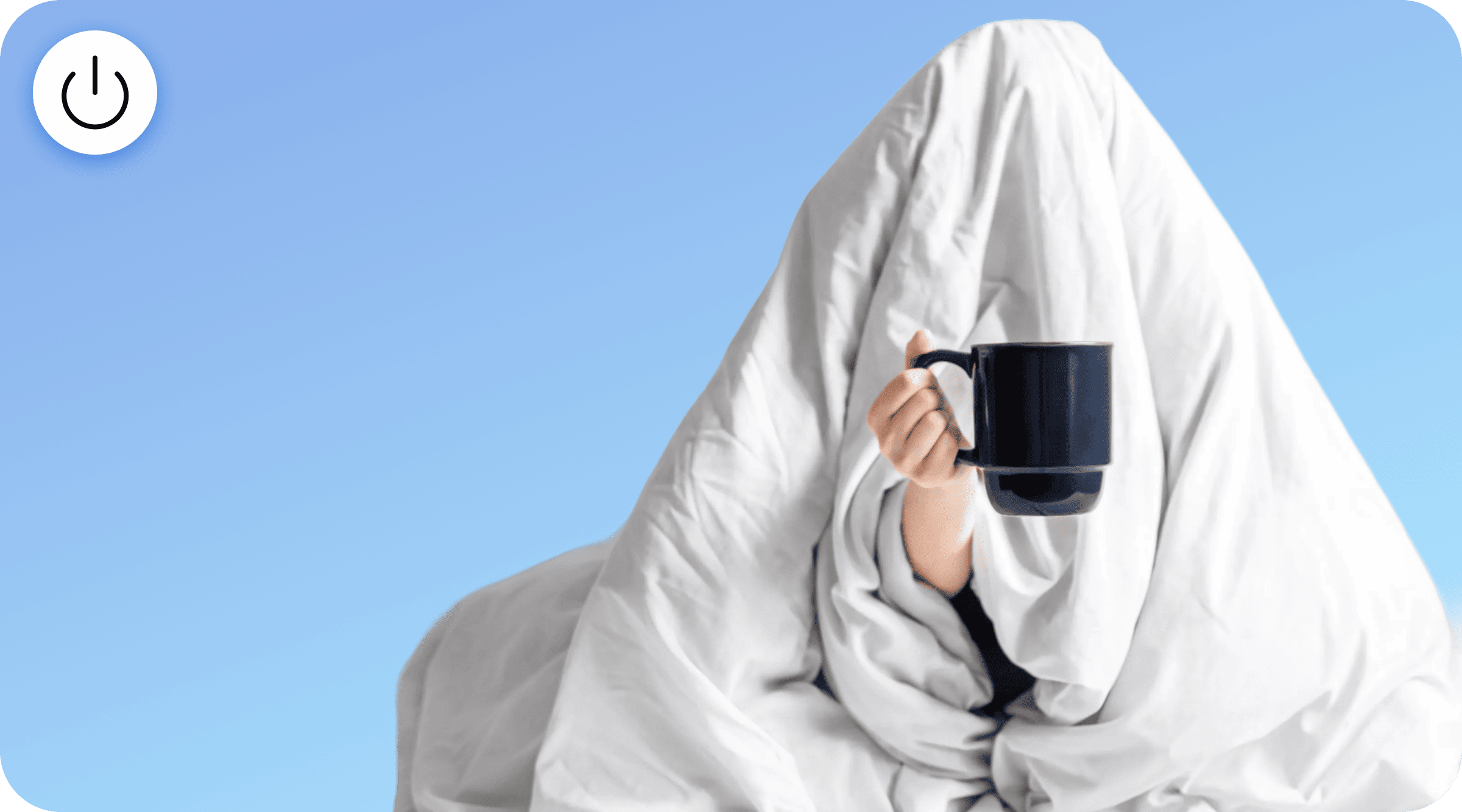 a man with a cup of cocoa wrapped in a blanket
